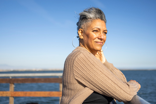 elderly person relaxing at the pier