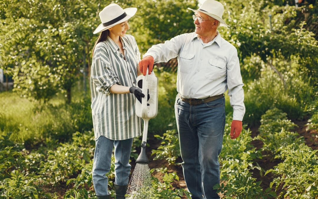 a man and a woman watering plants together