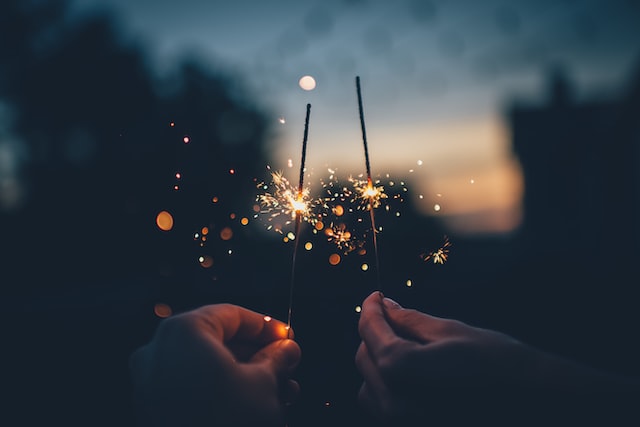 person holding fire crackers