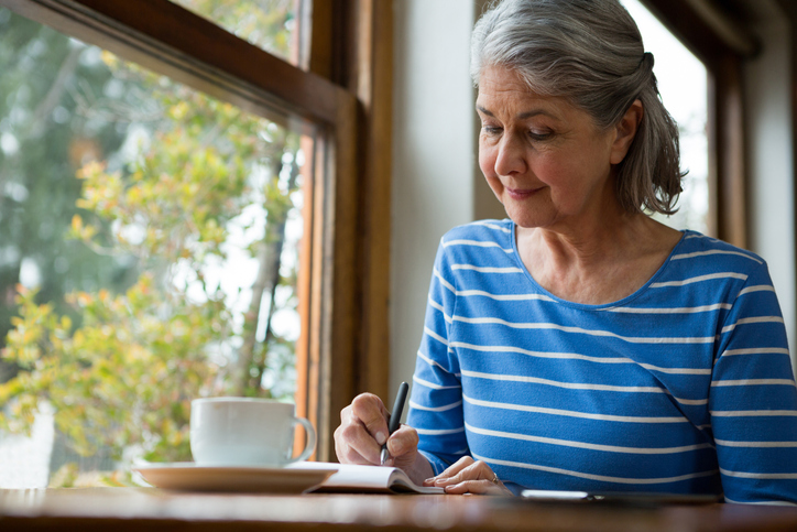 senior woman writing